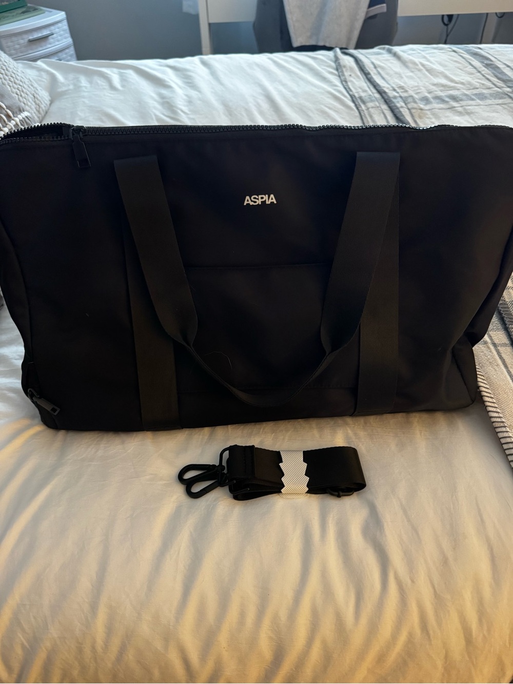 Black duffel bag with detachable strap